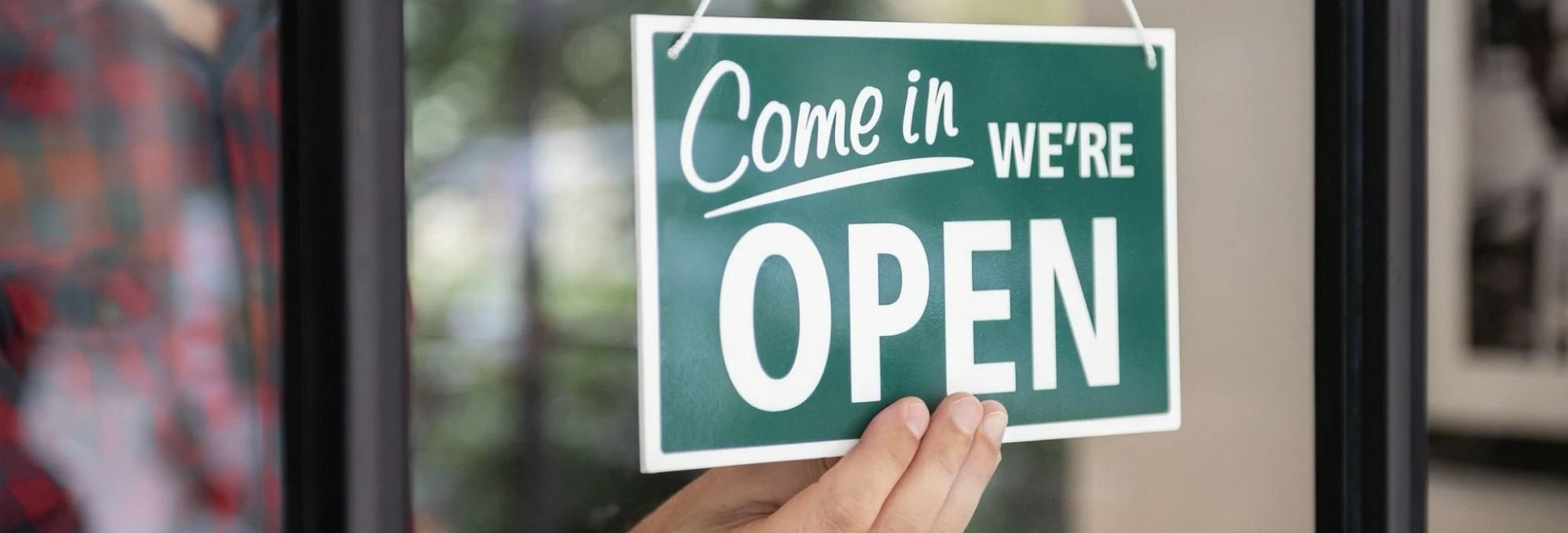 Green open sign in store window from Butler Floors in the Austin, TX area