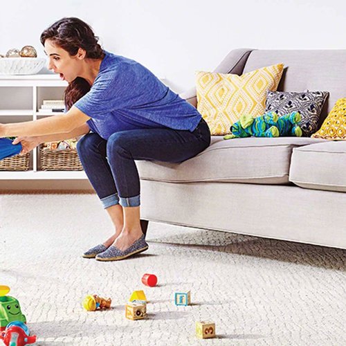 Mom tries to keep her kid from spilling soda on white carpet from Butler Floors in the Austin, TX area