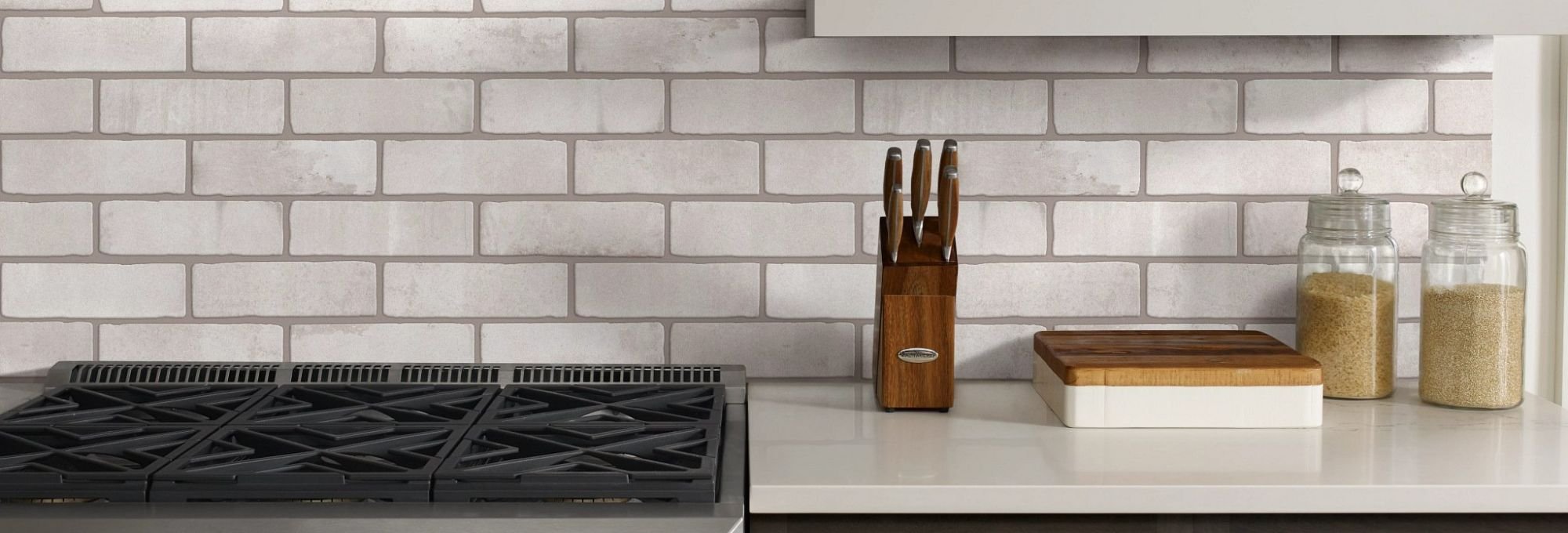 Kitchen with white tile brick backsplash from Butler Floors in the Austin, TX area